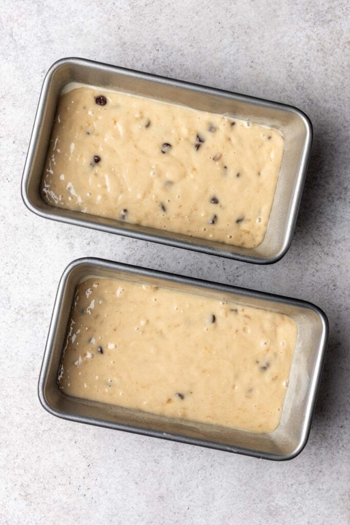banana bread batter in two loaf pans