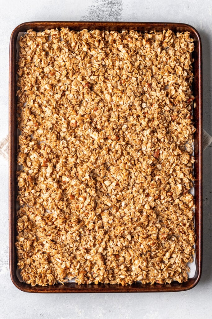 cooked granola on a sheet pan