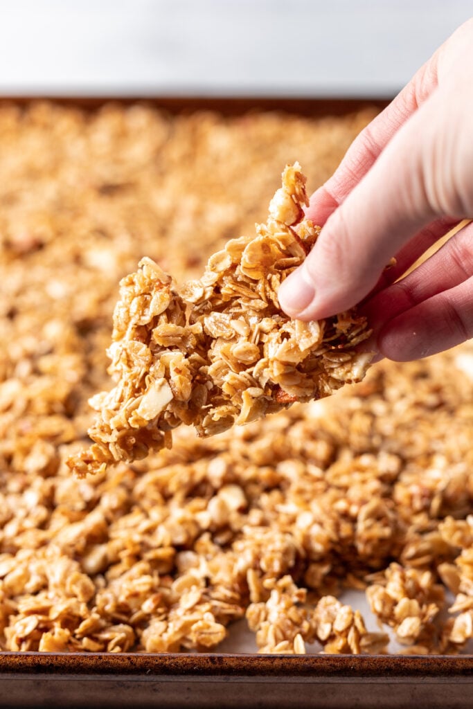 a chunk of granola being held