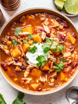 big bowl of sweet potato chicken chili topped with sour cream