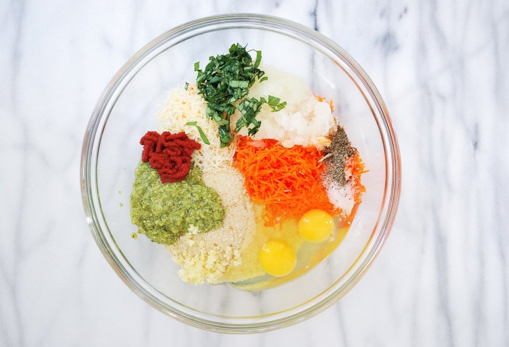 overhead shot of glass bowl with ingredients ready to make meatballs