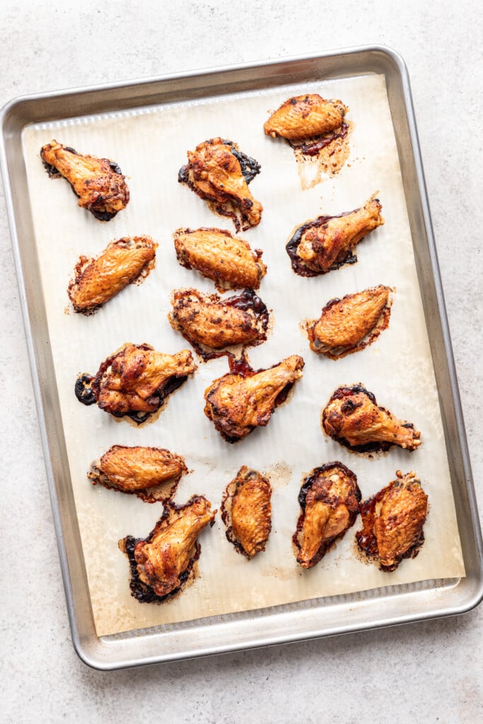 cooked chicken wings on a sheet pan