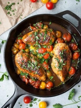 Honey Balsamic Chicken w/ Cherry Tomatoes in a cast iron skillet