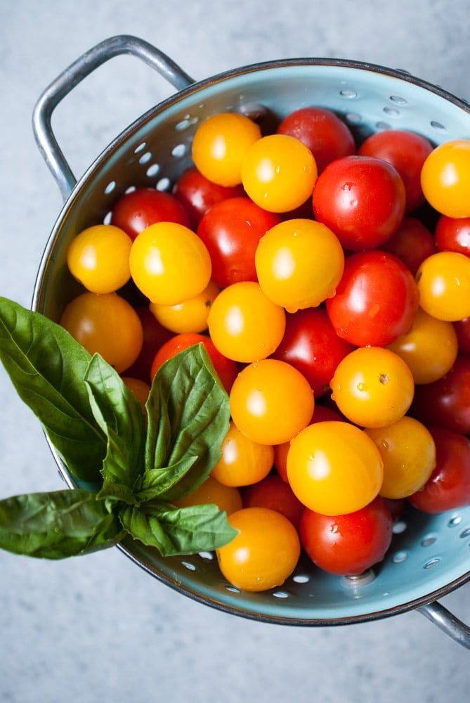 bowl of cherry tomatoes that are red and yellow