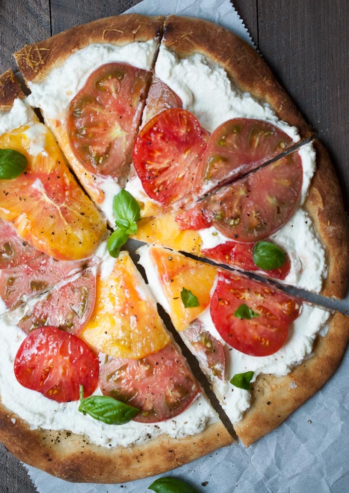 sliced pizza with tomatoes