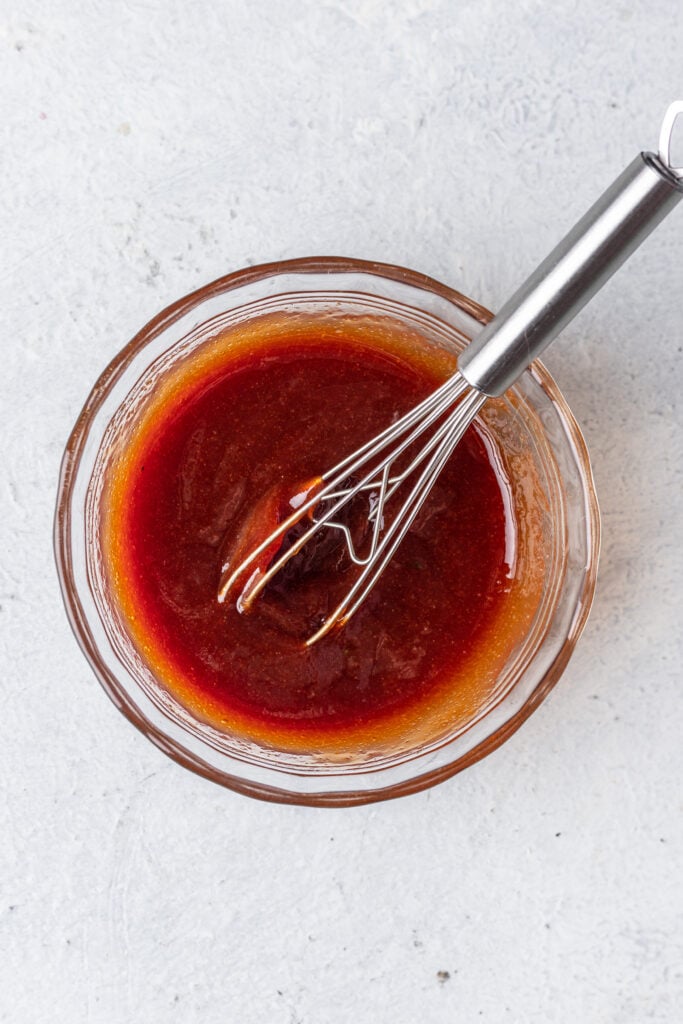 glaze in a small bowl with a whisk