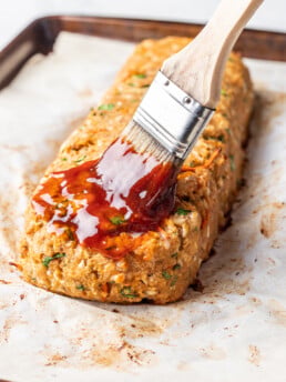 glaze being brushed over turkey meatloaf