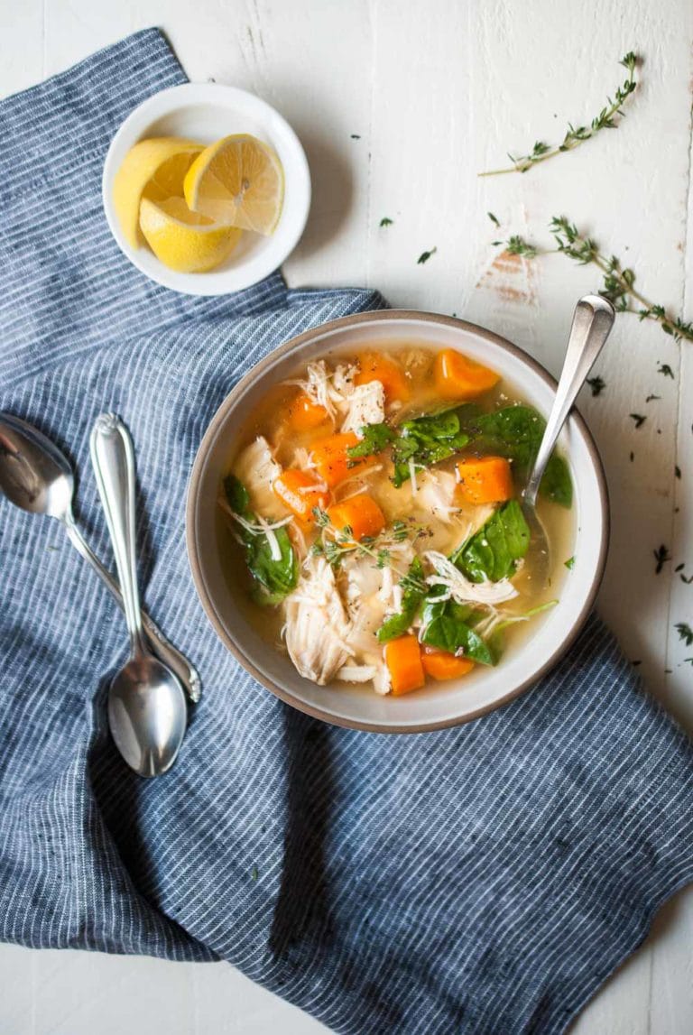 chicken soup in a bowl with a spoon