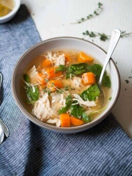Instant Pot Lemon Chicken Soup in a bowl with a spoon