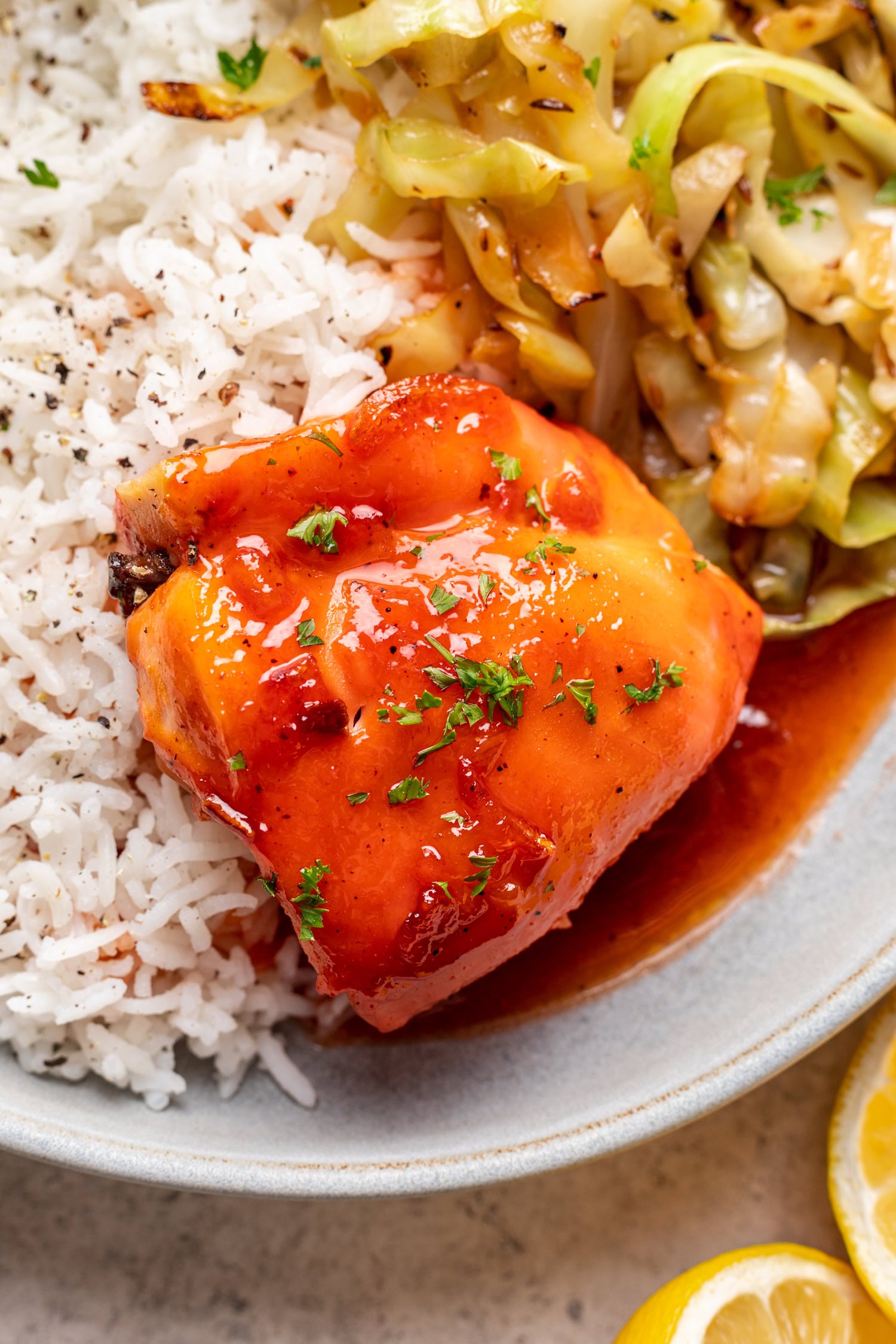 white place with rice, veggies and a piece of chicken