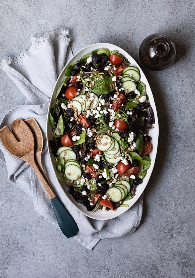 spring salad on a white platter