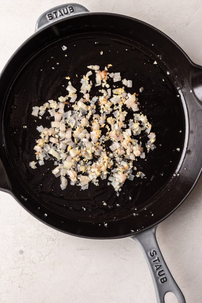 shallot and garlic sauteed in a pan