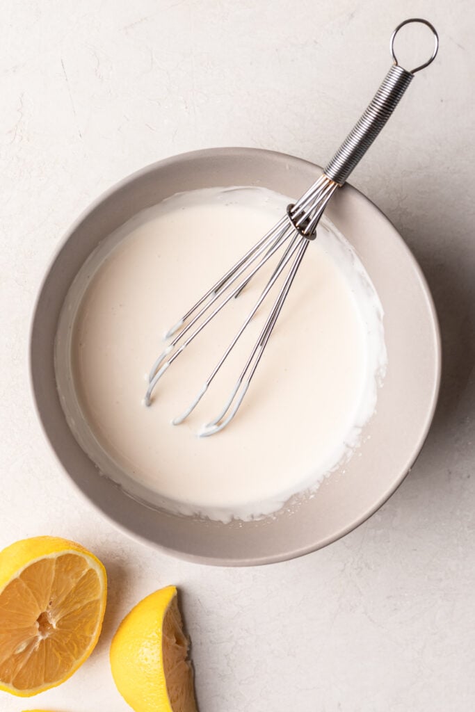 mayo sauce with a whisk in a bowl