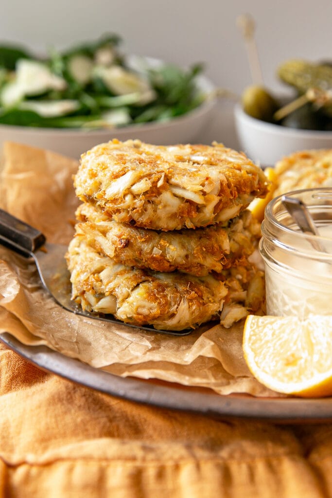 Stack of Fresh Crab Cakes with Lemon Wedge