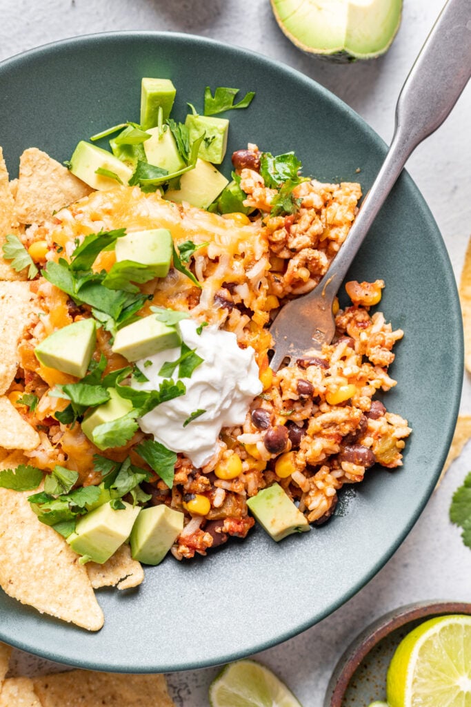 taco casserole on a plate with a fork