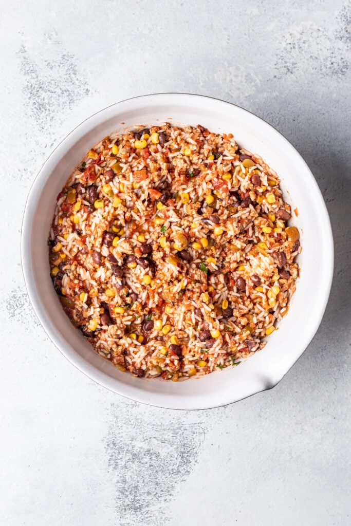 rice mixed with ground taco meat mixture in a bowl