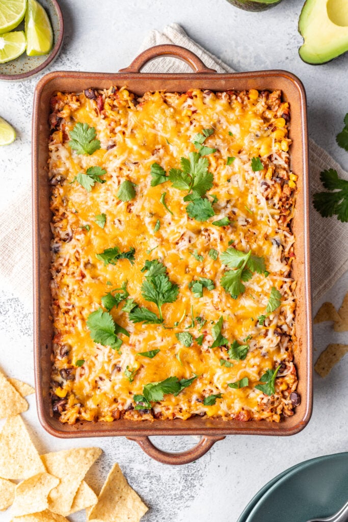 taco bake with fresh herbs on top