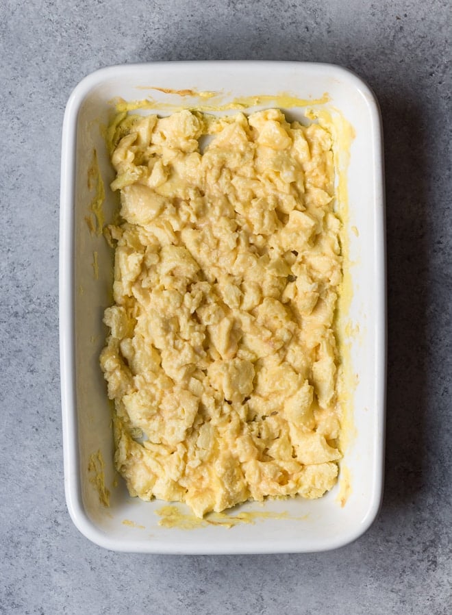 scrambled eggs in a large white baking dish