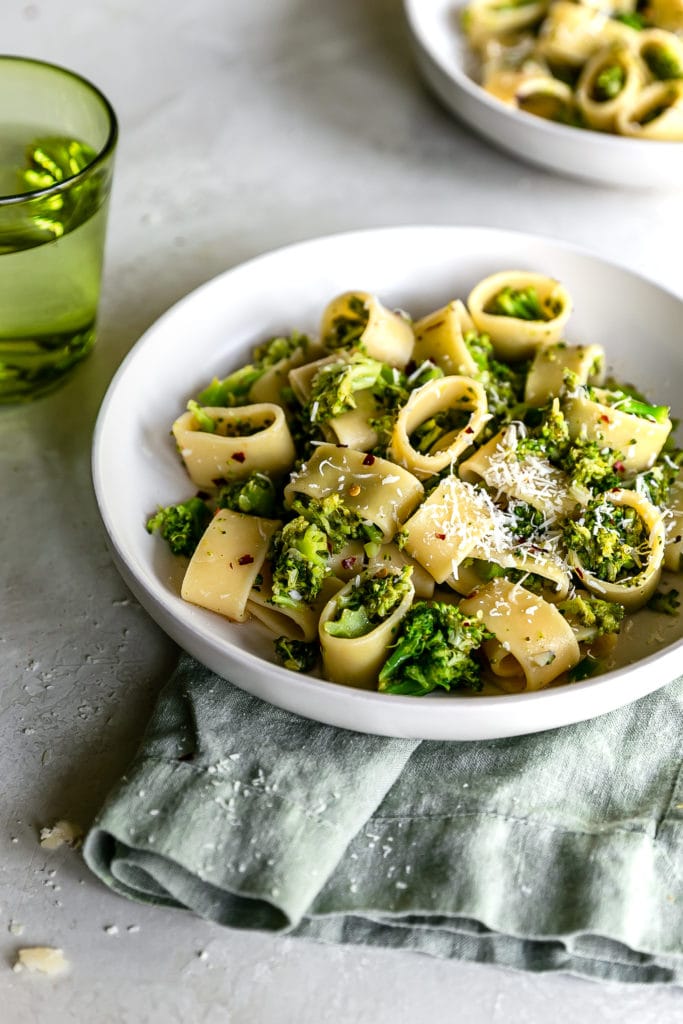 bowl of broccoli pasta on a linen napkin