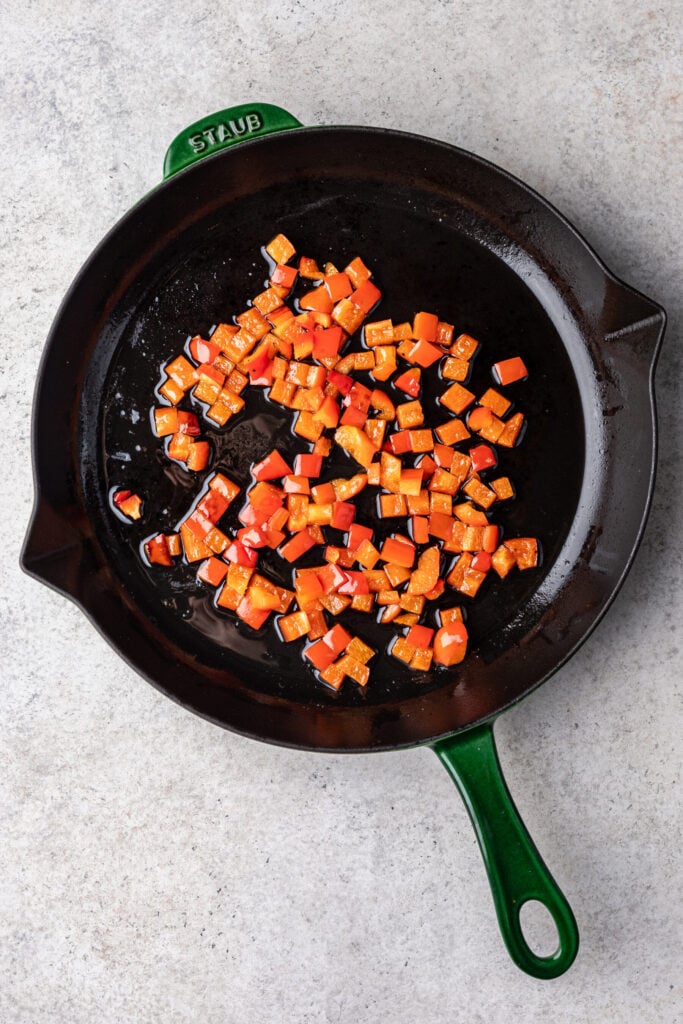cast iron skillet with chopped bell peppers