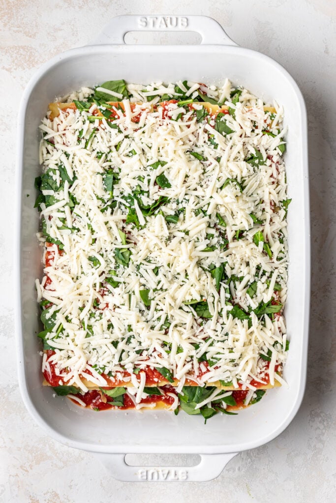 unbaked lasagna in a baking dish