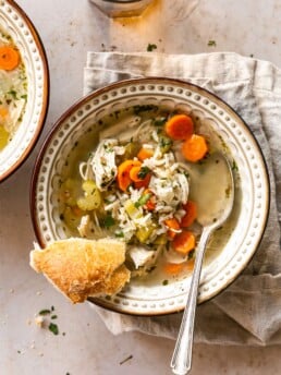 Shredded Chicken and Rice Soup in a Bowl with Slice of Bread