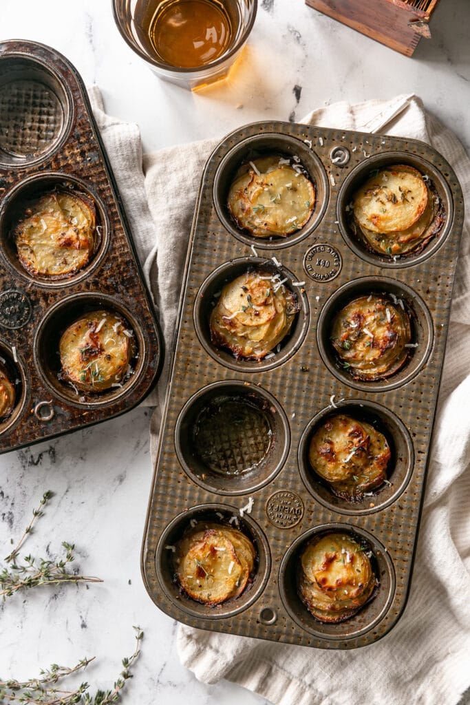 crispy baked and stacked potatoes in a muffin tin