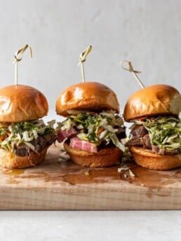 Shot of Three Steak Sliders on a Cutting Board