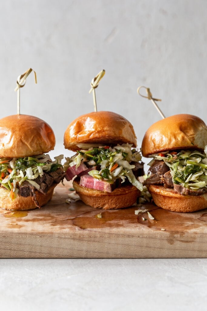 Shot of Three Steak Sliders on a Cutting Board