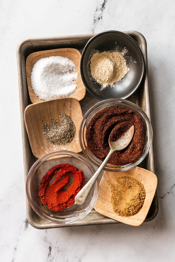 salt pepper garlic powder chili powder paprika and cumin in dishes