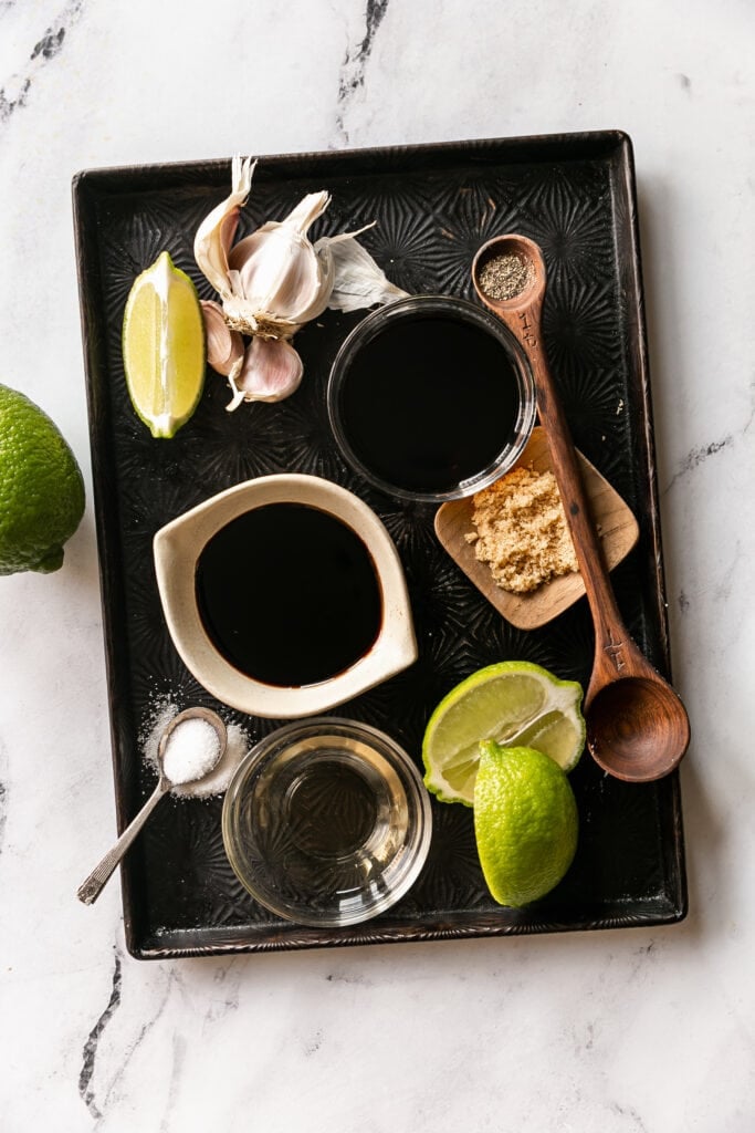 The Best Balsamic Steak Marinade - soy sauce, balsamic vinegar, lime juice, rice wine vinegar and brown sugar on a sheet pan