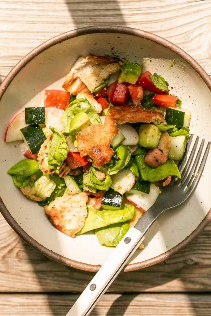 Summer Fattoush Salad - EXTRA - tossed salad in hard light with bowl and fork