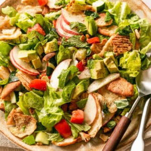 Summer Fattoush Salad - tossed salad on platter with serving utensils