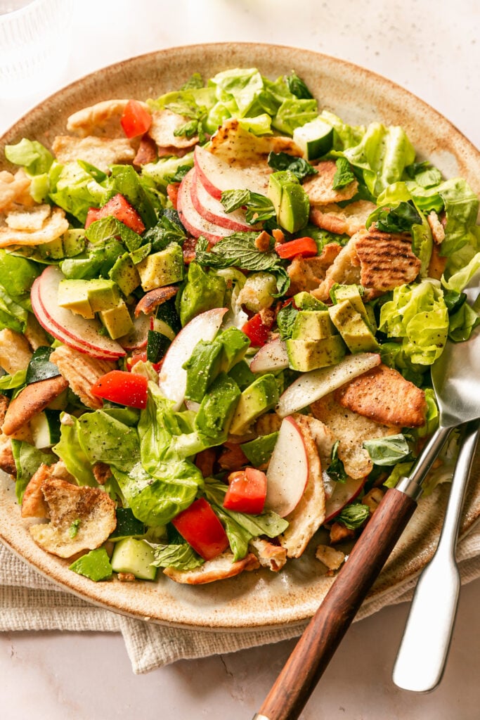 Summer Fattoush Salad - tossed salad on platter with serving utensils