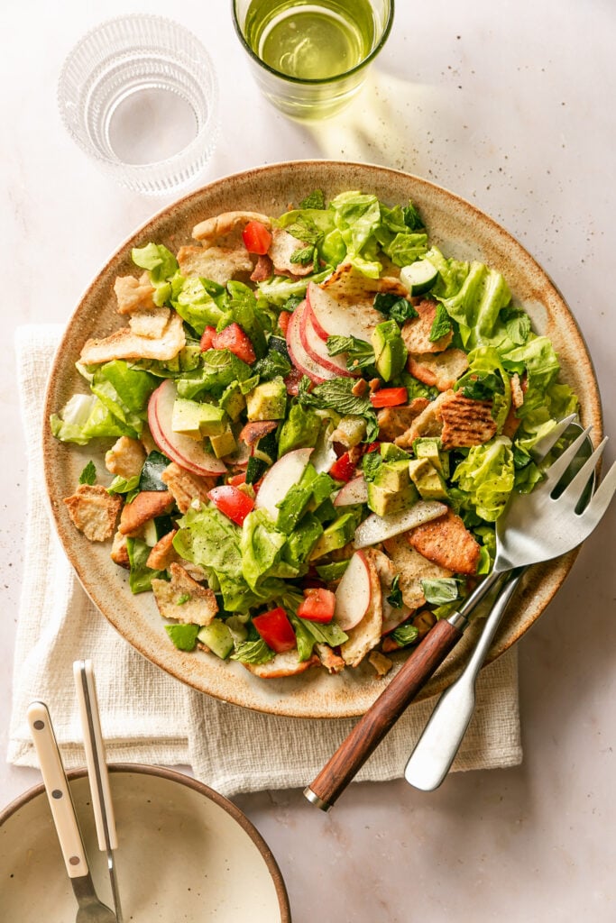 Summer Fattoush Salad - tossed salad on platter with serving utensils