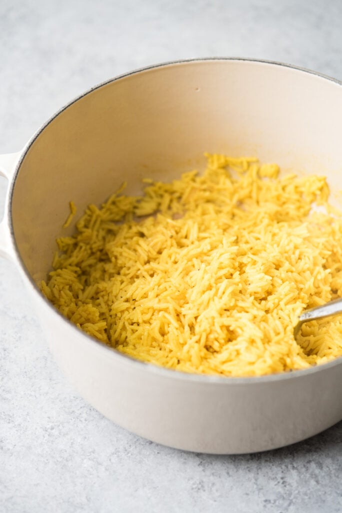pot of cooked turmeric garlic rice