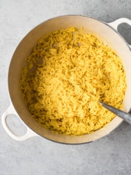 overhead shot of yellow rice in a pot