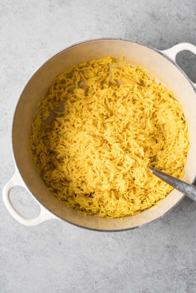 overhead shot of yellow rice in a pot