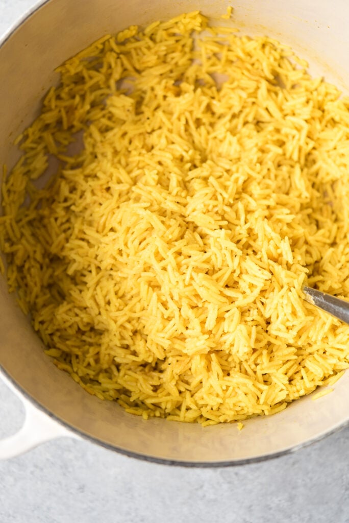 pot of cooked turmeric garlic rice