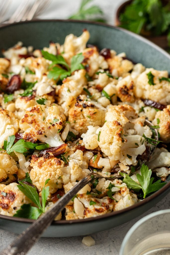 roasted cauliflower in a bowl with parsley