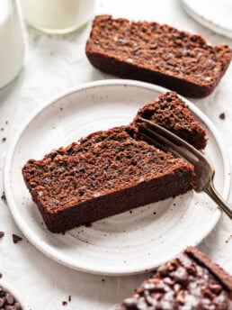 slice of double chocolate banana bread being eaten with a fork