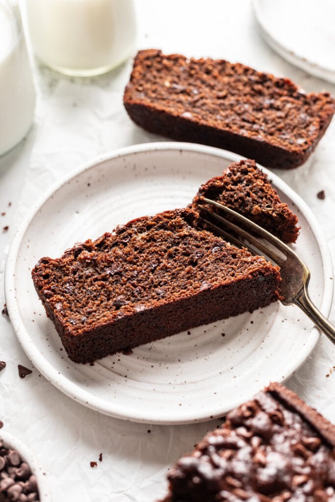 slice of double chocolate banana bread being eaten with a fork