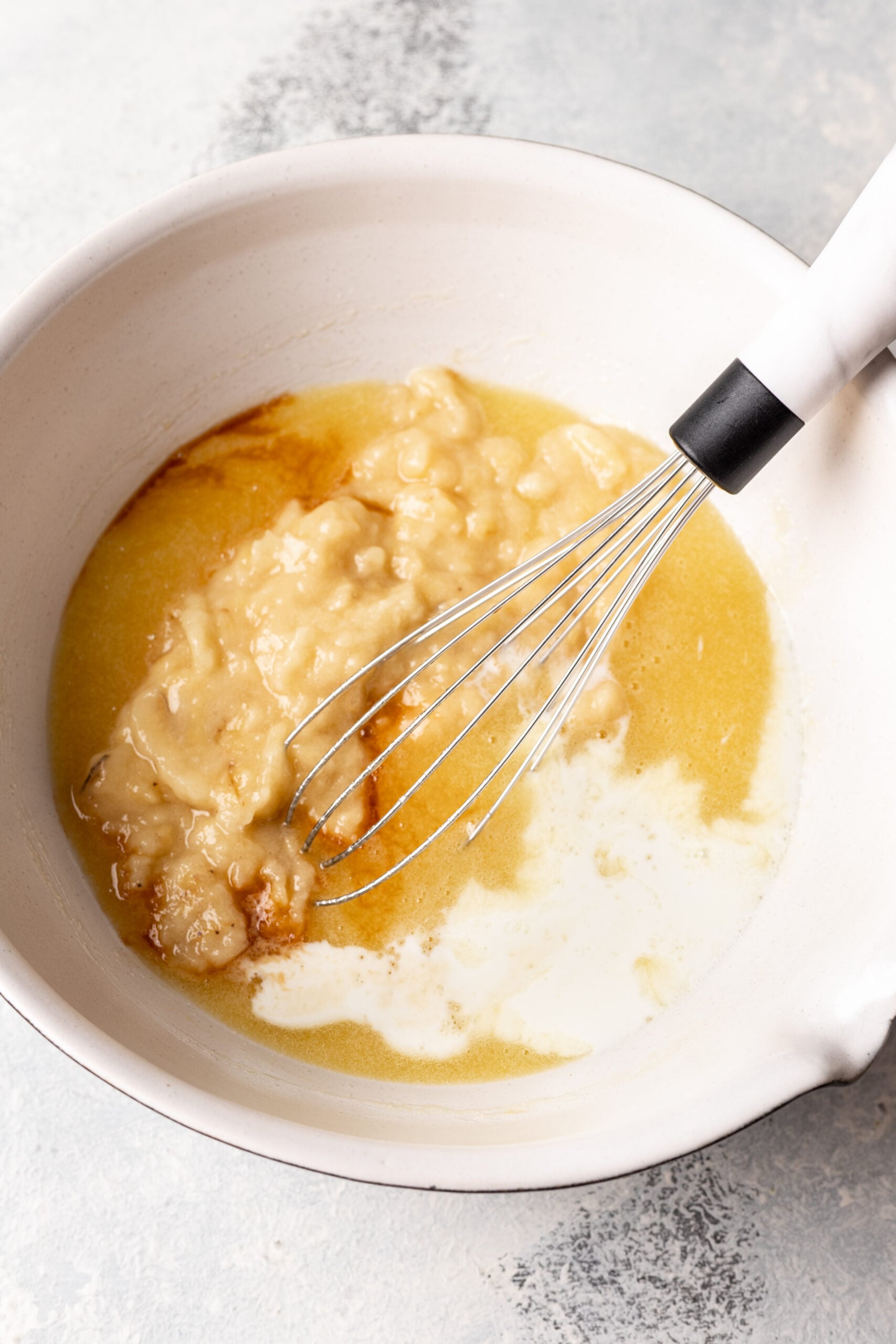 eggs, sugar, mashed banana, milk and vanilla in a bowl