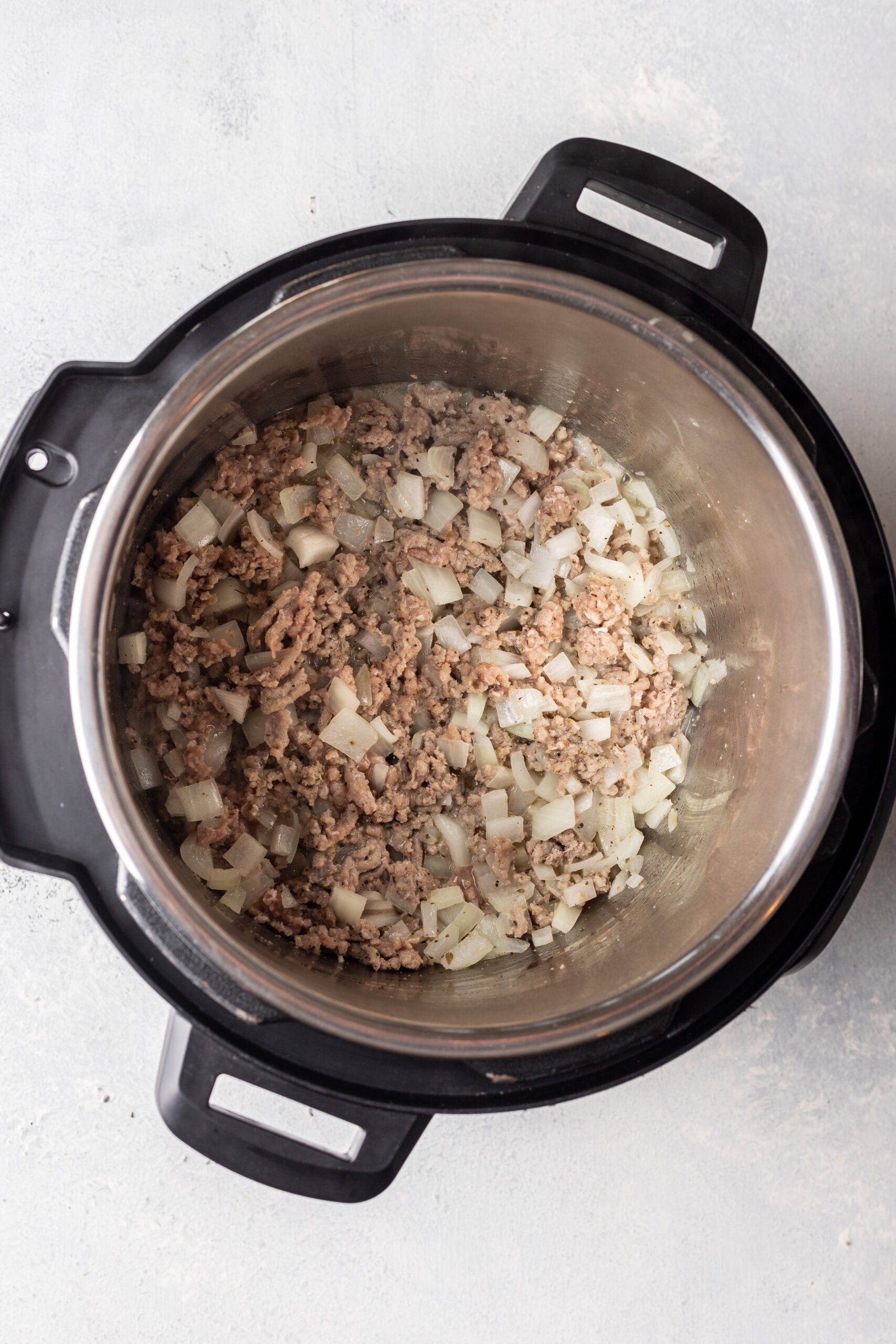 instant pot with onions and cooked ground turkey