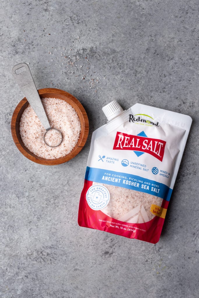package of redmonds kosher salt with some on a bowl on the side