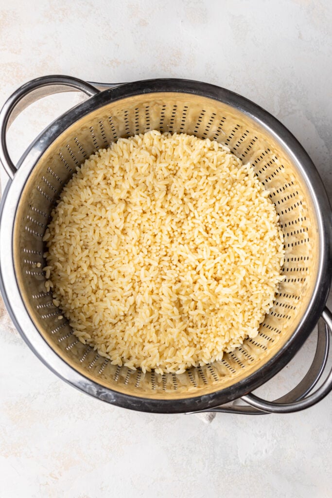 cooked orzo in a strainer