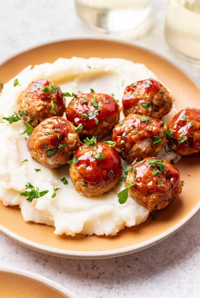 meatballs on a plate with mashed potatoes