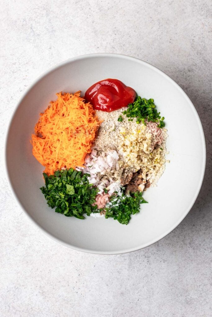 ingredients in a white bowl for meatballs