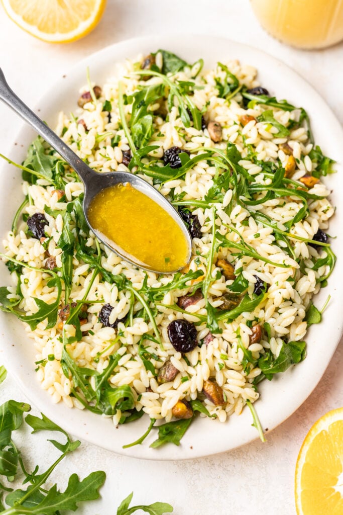 citrus dressing drizzled over orzo pasta