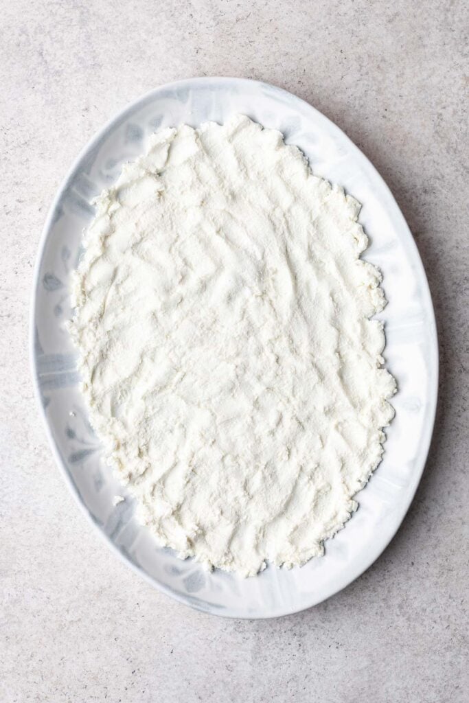goat cheese spread on a white platter